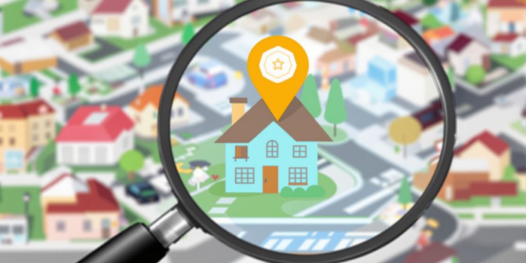 Local SEO for contractors: a magnifying glass over a house.